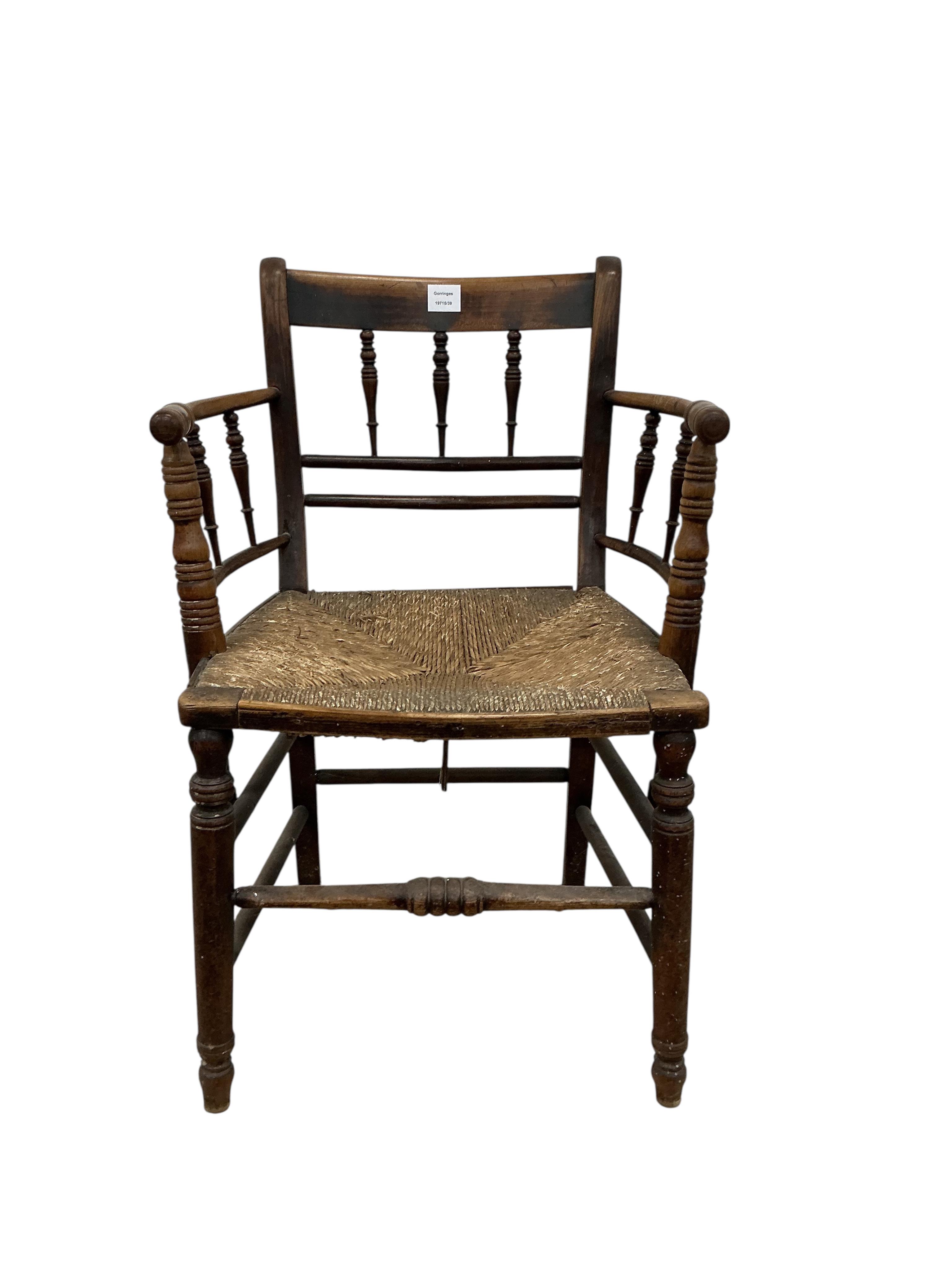 A Victorian Sussex style fruitwood rush seated elbow chair, width 53cm, depth 43cm, height 85cm